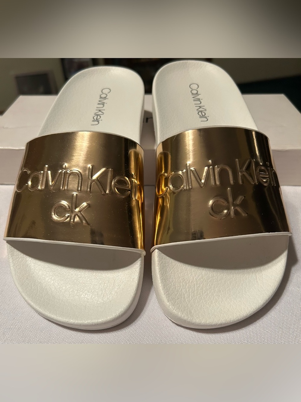Calvin Klein White Slides with Metallic Rose Gold Logo Strap